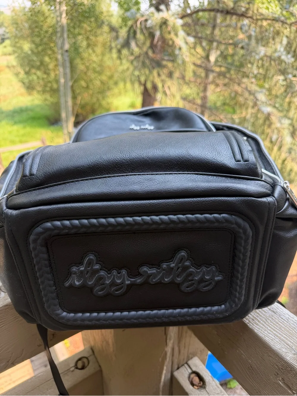 Itzy Ritzy Black Faux Leather Baby Backpack with Tassel Charm
